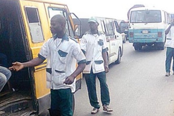 Lagos NURTW members collecting money from comercial bus drivers